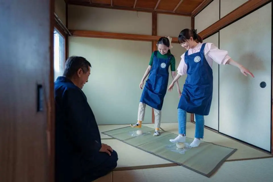 The udon-making experience begins with kneading the dough.