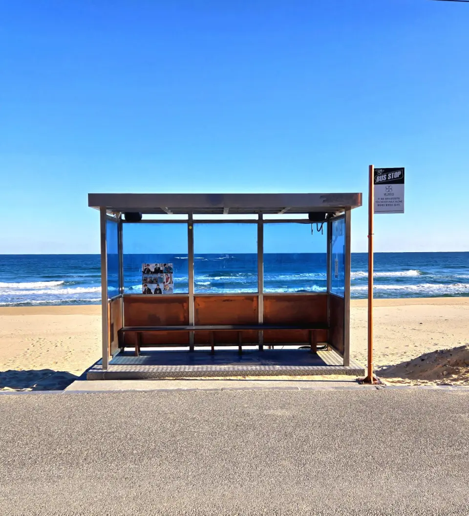 Iconic BTS bus stop at Jumunjin Hyangho Beach, a must-visit KPOP pilgrimage site with a sandy beach and stunning blue ocean view.