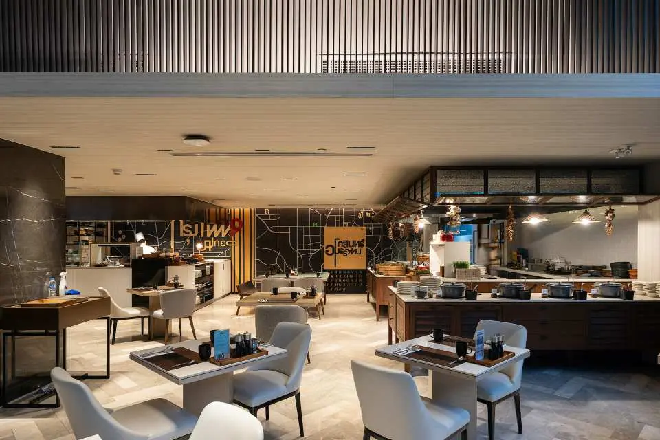 Immerse yourself in Bangkok’s vibrant energy while savoring wine and beer in a chic, lively setting