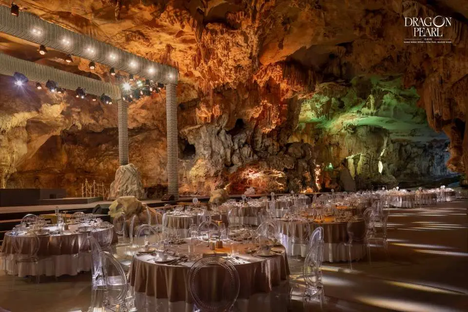 Dine inside a dramatic stone cave, where warm lighting and natural rock walls create a mystical, otherworldly atmosphere.