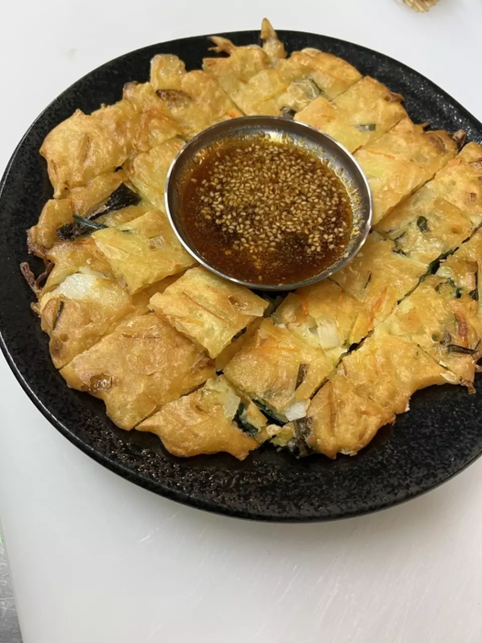 Our most popular item is the "Cheese Chijimi" which is crispy on the outside and fluffy on the inside! It's so popular that many customers come to try the cheese chijimi and order it as their first order. The rich flavor of cheddar cheese and mixed cheese is accented by the delicious taste of bacon. Enjoy it with our homemade dipping sauce and honey to create your favorite taste. We also have a wide variety of other chijimi available!