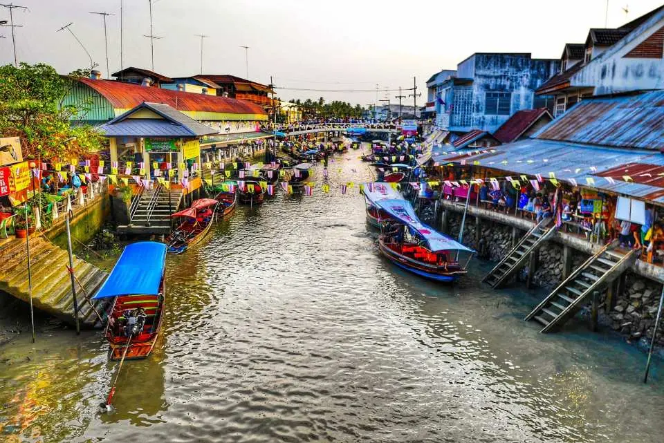 Head to Amphawa, one of Thailand’s most beloved floating markets. Stroll along canals lined with food stalls, souvenirs, and local treats. Optional boat ride available.