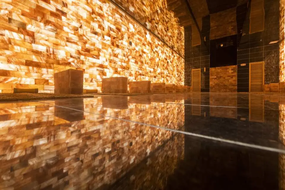 Experience deep relaxation in the Himalayan Salt Room, where natural salt walls promote wellness and tranquility.