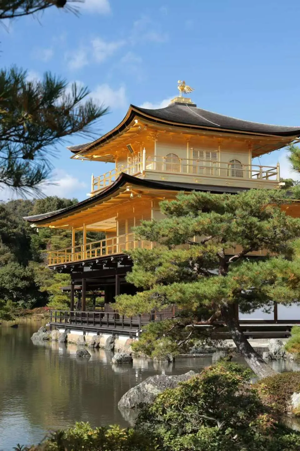 One of Kyoto's most famous World Heritage Sites, the three-story pavilion, covered in gold leaf, is reflected in the tranquil pond, creating a breathtaking scene. Traditional experiences for praying for wealth and good fortune are also available within the temple grounds.