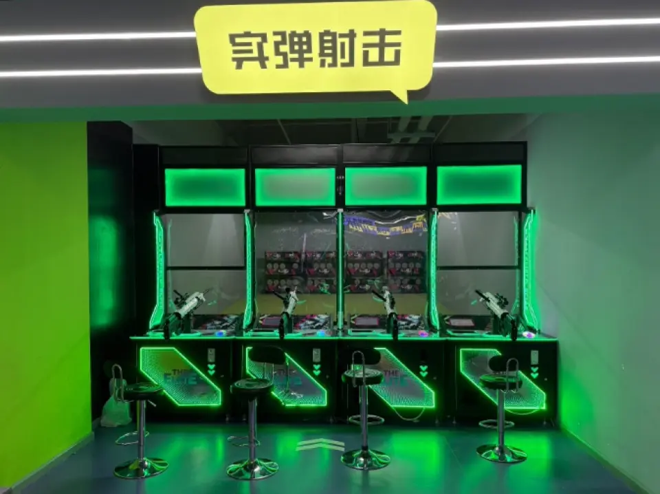 Shenzhen Airpai Sports Carnival's indoor live-fire shooting range, with multiple shooting targets under neon green lights, offering visitors an exciting live-fire shooting competition experience.