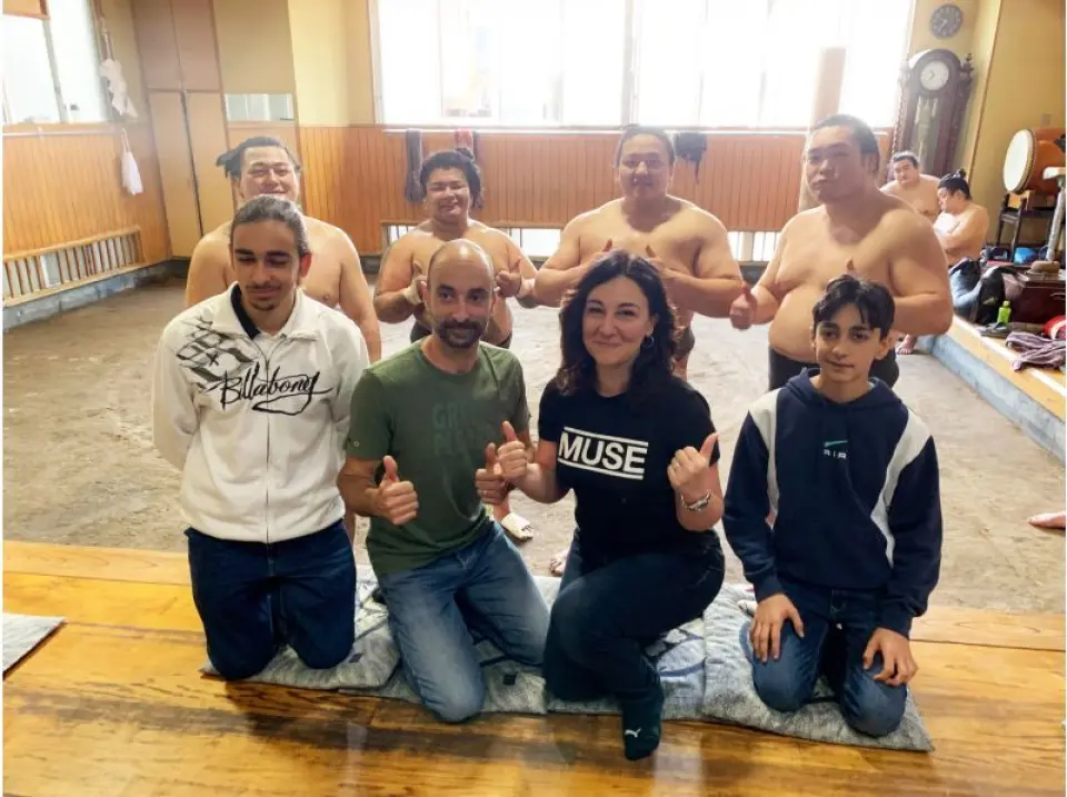 Commemorative photo with sumo wrestlers