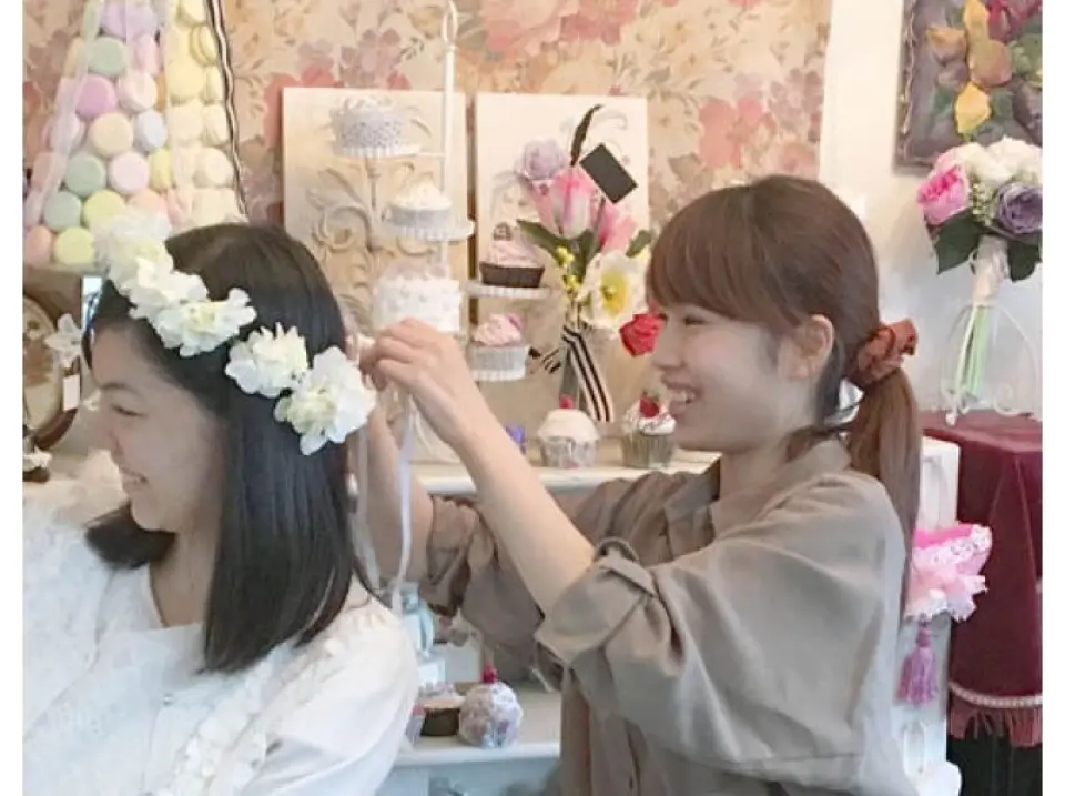 Adjustable with ribbon at the back