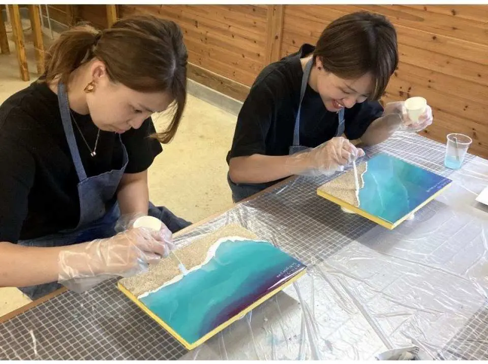 After covering it with resin, gently place some white paint on it for the waves.