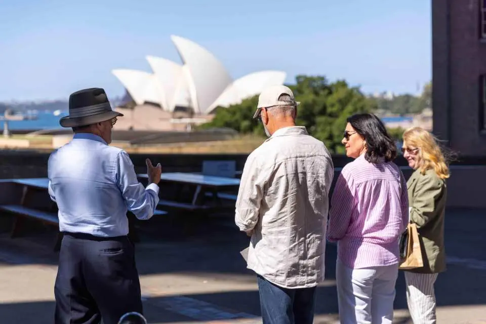 Tour guide commentary about Opera House