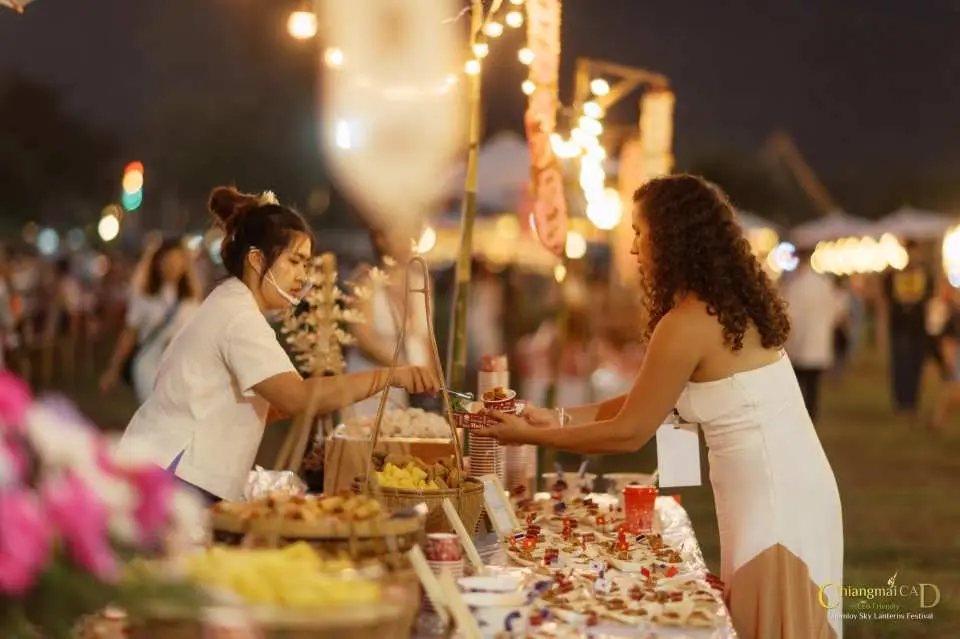 Delight in an authentic Thai Lanna Buffet Dinner, featuring a selection of snacks, desserts, and non-alcoholic beverages