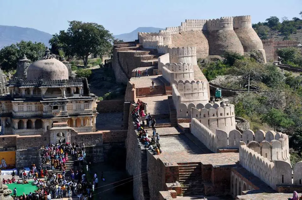 Travel through scenic Aravalli hills to reach the mighty Kumbhalgarh Fort, renowned for its 36-km-long wall and stunning hilltop views. Explore palaces, temples, and hidden corners of this UNESCO World Heritage Site.