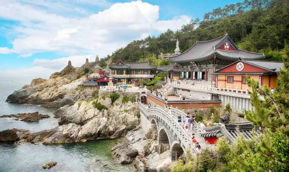 Haedong Yonggungsa Temple is a stunning sanctuary dramatically perched on rugged cliffs where the mountains meet the endless ocean
