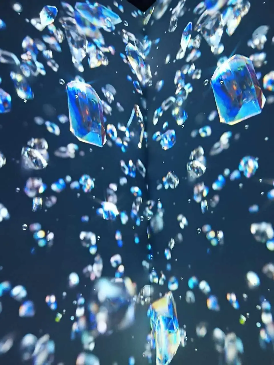 Gallery 1 | Infinity Fall
The moment you step inside, the tropical heat outside fades away. A cooling waterfall, blooming flowers, and icy crystals surround you. Designed with mirrored ceilings and floors, you will truly feel inside an infinite world.