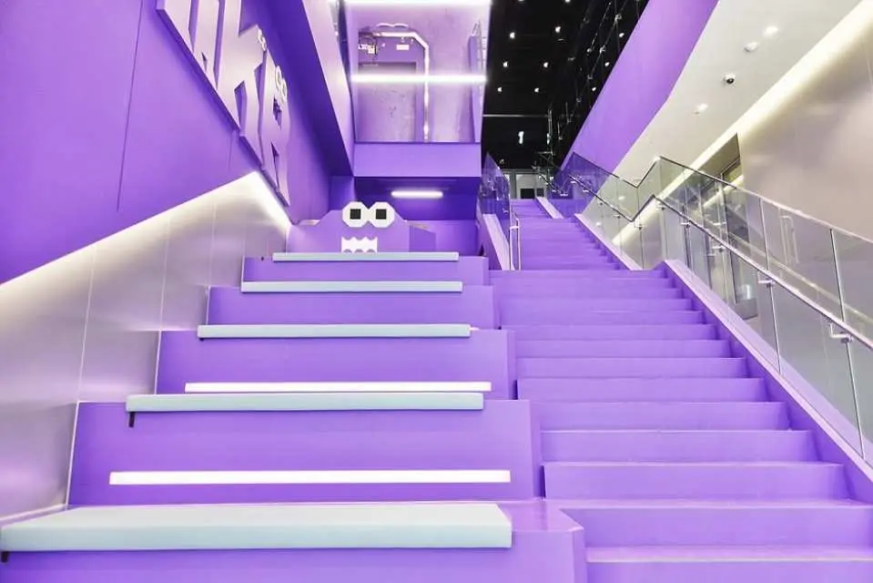 Take a walk up the iconic purple stairs—the perfect, trendy photo zone for your Instagram feed!
