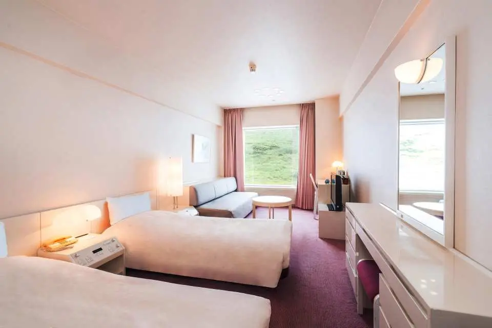Accommodation will be at the Naeba Prince Hotel or a similar onsen hotel. The Naeba Prince Hotel, located in Naeba Kogen, Yuzawa-cho, Niigata Prefecture, is one of Japan's largest highland resort hotels, operated by the Prince Hotel Group. Situated within the Joshinko-Gogaoka National Park, surrounded by mountains, the hotel offers distinct scenery in all four seasons and is a key accommodation point for autumn foliage viewing, summer retreats, and winter skiing in the Naeba area. The hotel boasts approximately 1,200 room and features several Japanese, Western, and buffet restaurants, shops, relaxation facilities, and a natural onsen, providing a comprehensive and comfortable resort environment. In autumn, guests can enjoy the vibrant autumn foliage of the Naeba Kogen, while in winter, it connects to the Naeba Ski Resort, making it one of Japan's most representative onsen and ski resort hotels.