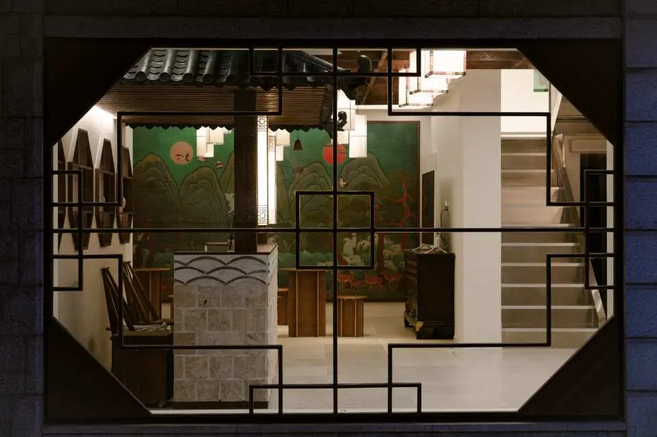 Step into a peaceful Hanok sanctuary, where warm wood, soft lighting, and natural textures create the perfect retreat from Seoul’s busy streets.”