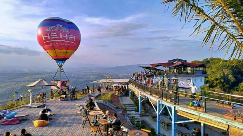A relaxing hilltop escape at HeHa Sky View with panoramic Yogyakarta views, refreshing breeze, and distant Mount Merapi.