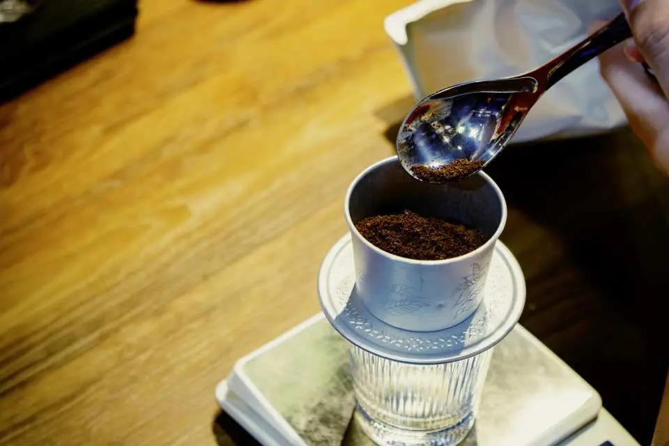 Learn the magic behind the famous phin filter and discover the unique Vietnamese coffee beans (Robusta) that power the nation.