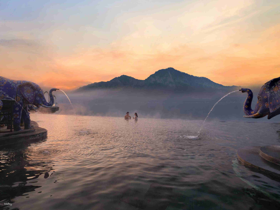 Enjoy a relaxing soak in the hot spring while taking in the stunning mountain backdrop.